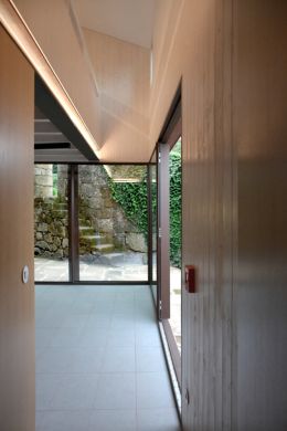 A room with indirect lighting that highlights the woodwork